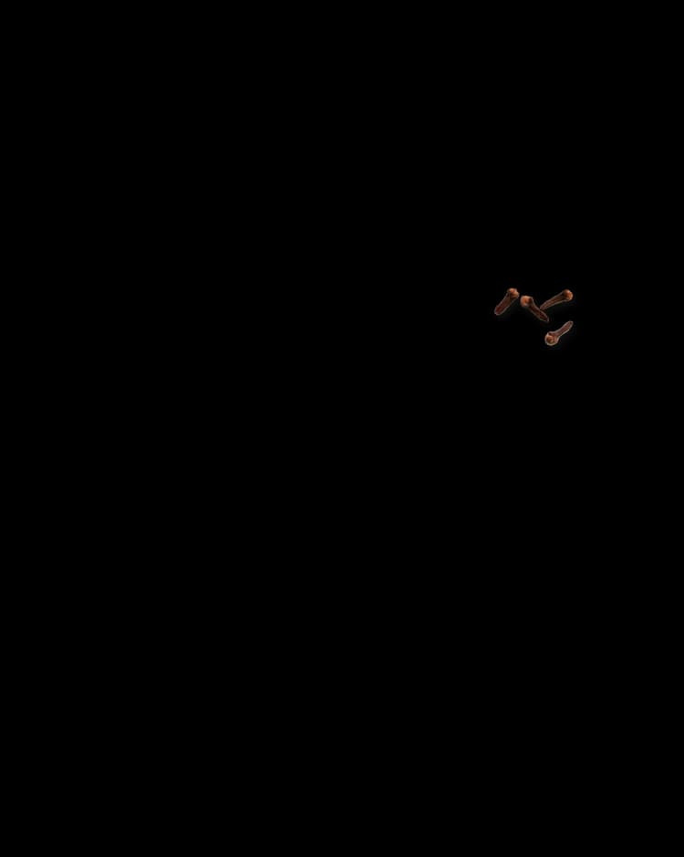 A wooden mannequin is posed in a dynamic, midair position against a black background, as if leaping or falling.