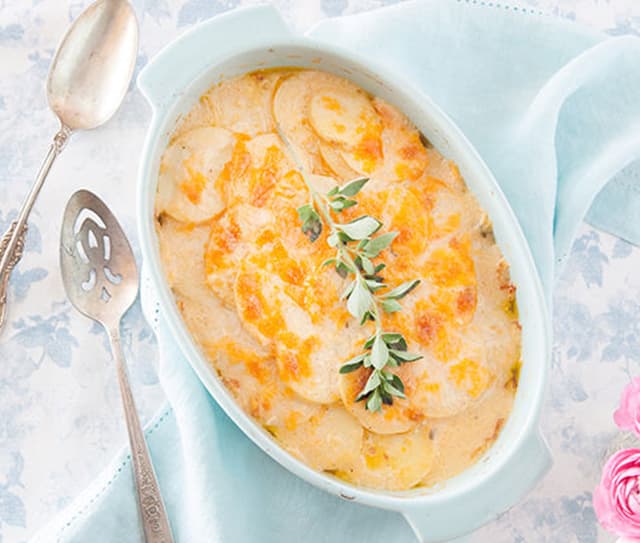 Casserole dish full of savory scalloped potatoes