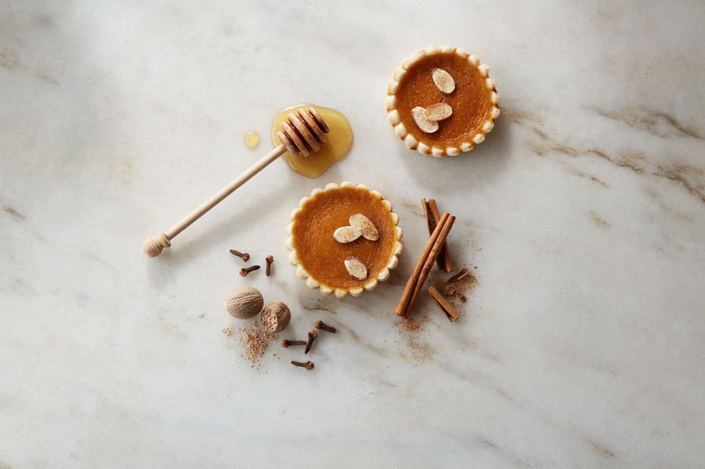 Two honey pumpkin mini tarts topped with shaved Blue Diamond Almonds