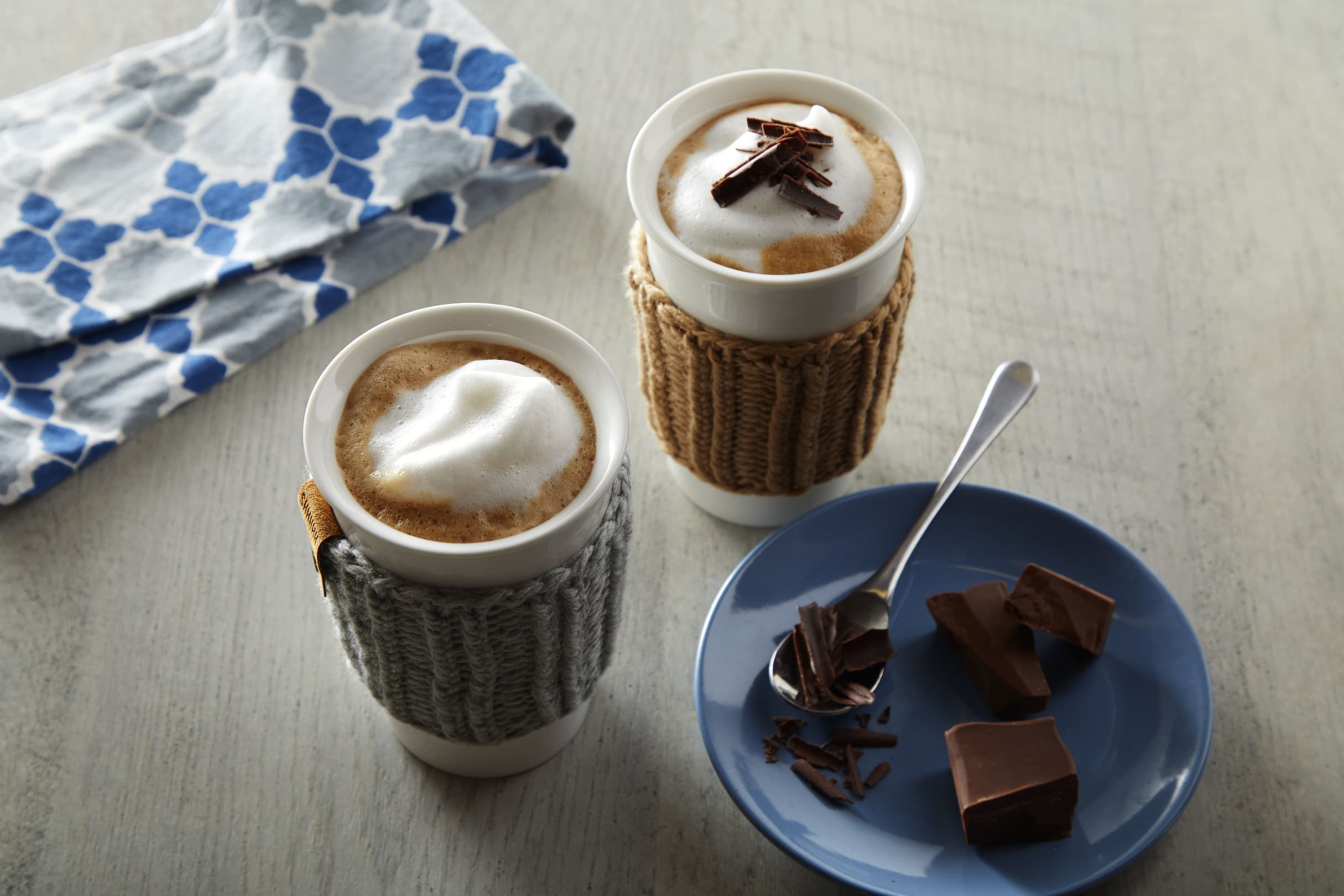 Creamy chocolate mocha mugs topped with frothed Almond Breeze Extra Creamy Almondmilk