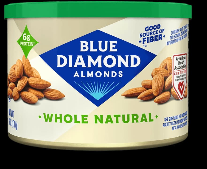 A can of Blue Diamond Whole Natural Almonds, showing nutritional claims like 6g protein, good source of fiber, and American Heart Association Heart-Check certification.