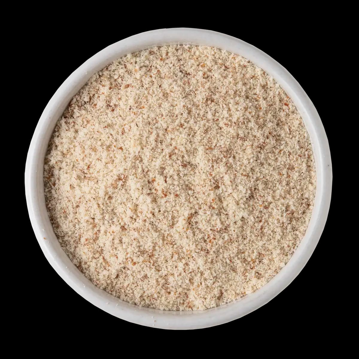 A white bowl filled with finely ground almond flour, viewed from above, on a black background.