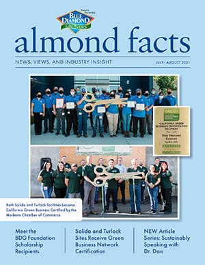 Cover of Almond Facts magazine, July-August 2021, featuring groups holding awards and plaques, with headlines about scholarship recipients and green business certifications.