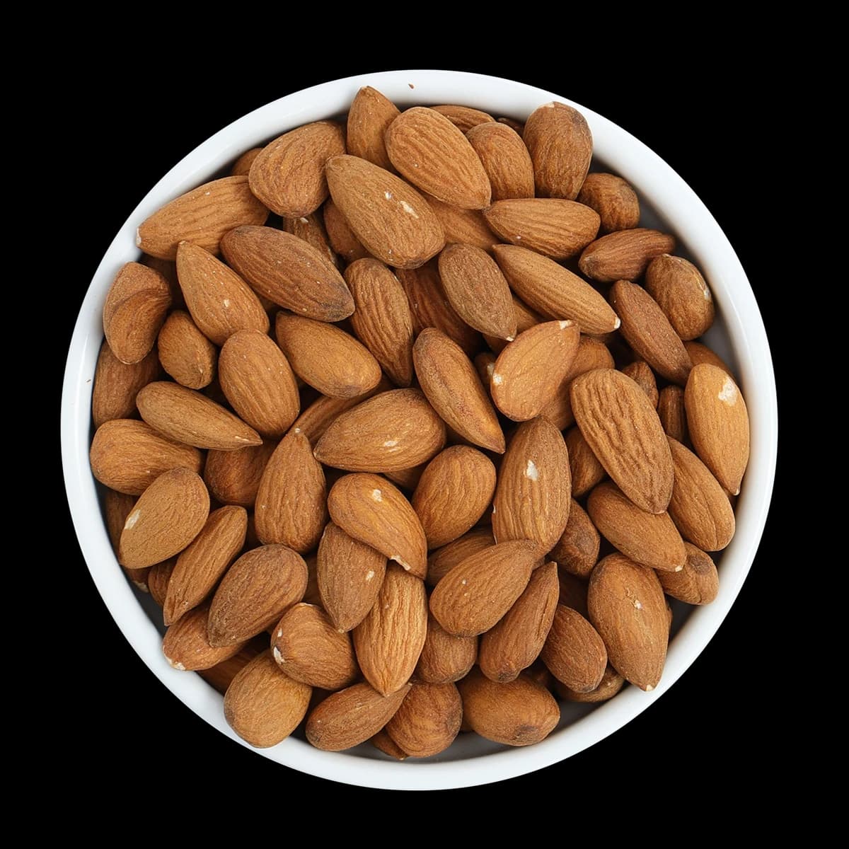 A white bowl filled with whole, raw almonds, viewed from above against a black background.