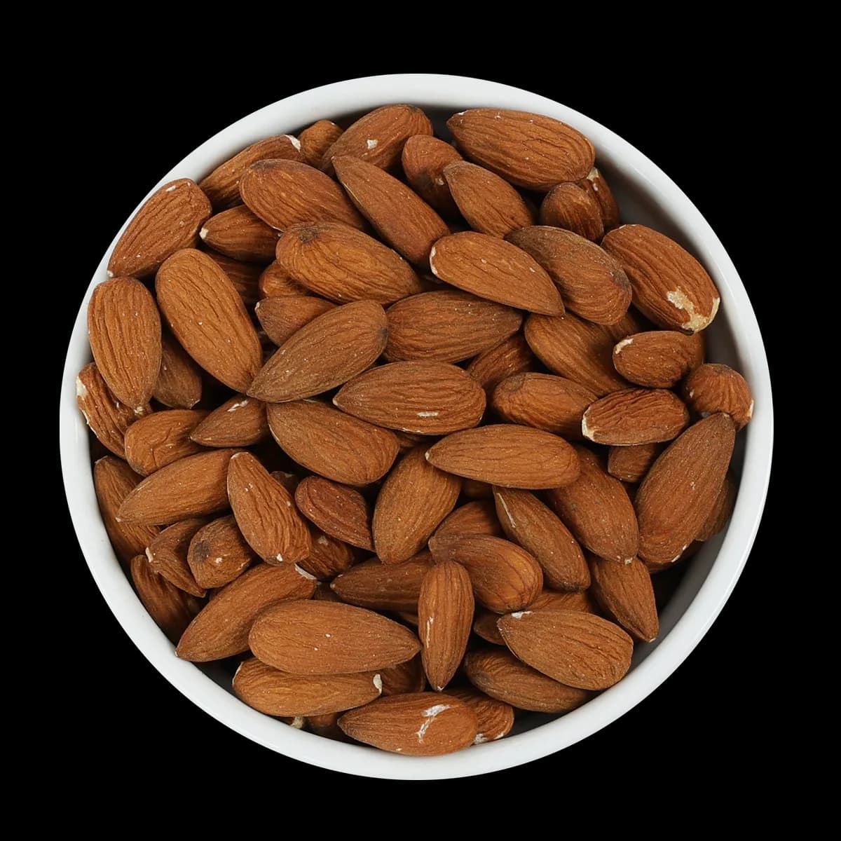 A white bowl filled with whole, unshelled almonds is shown from above on a black background.