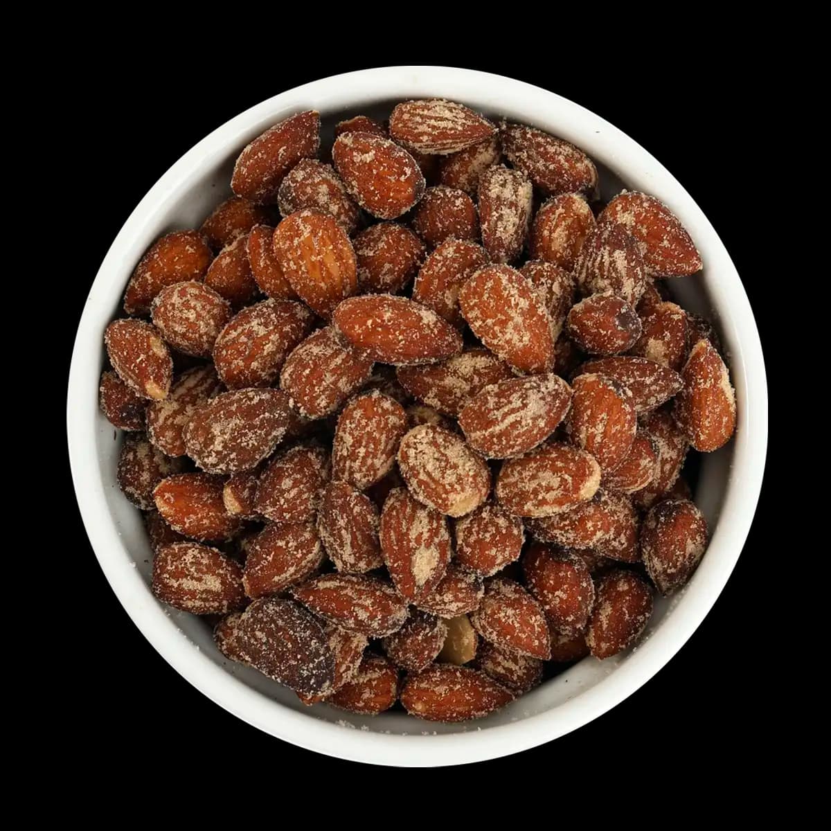 A white bowl filled with roasted almonds coated in seasoning, set against a black background.