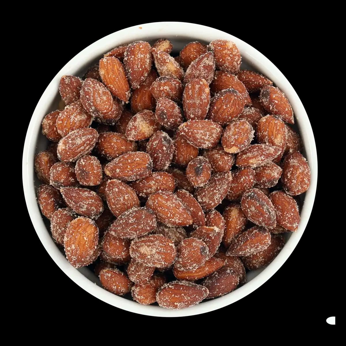 A white bowl filled with roasted almonds coated in seasoning, viewed from above against a black background.