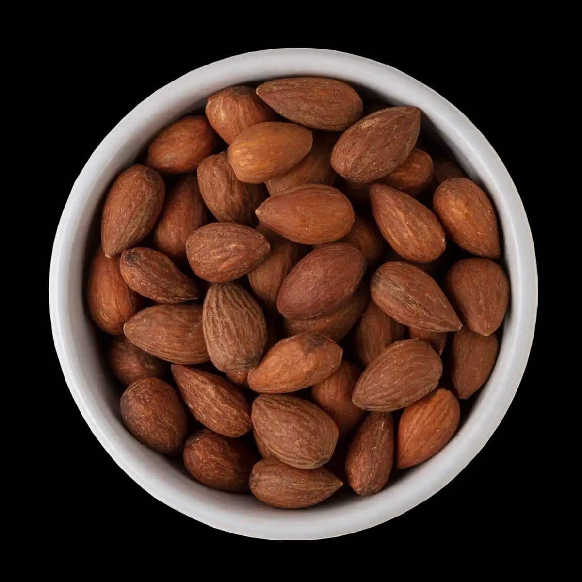 A white bowl filled with whole, unshelled almonds is shown from above against a black background.